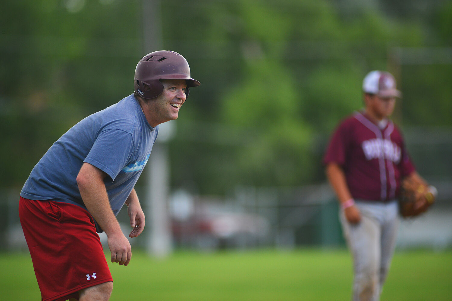 Chris Meyer laughs after making it to third base